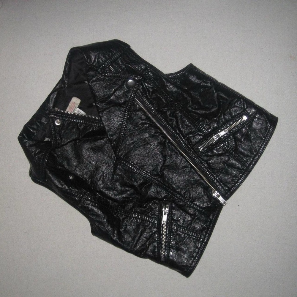 Black leather biker jacket with silver rock & roll vibe going out